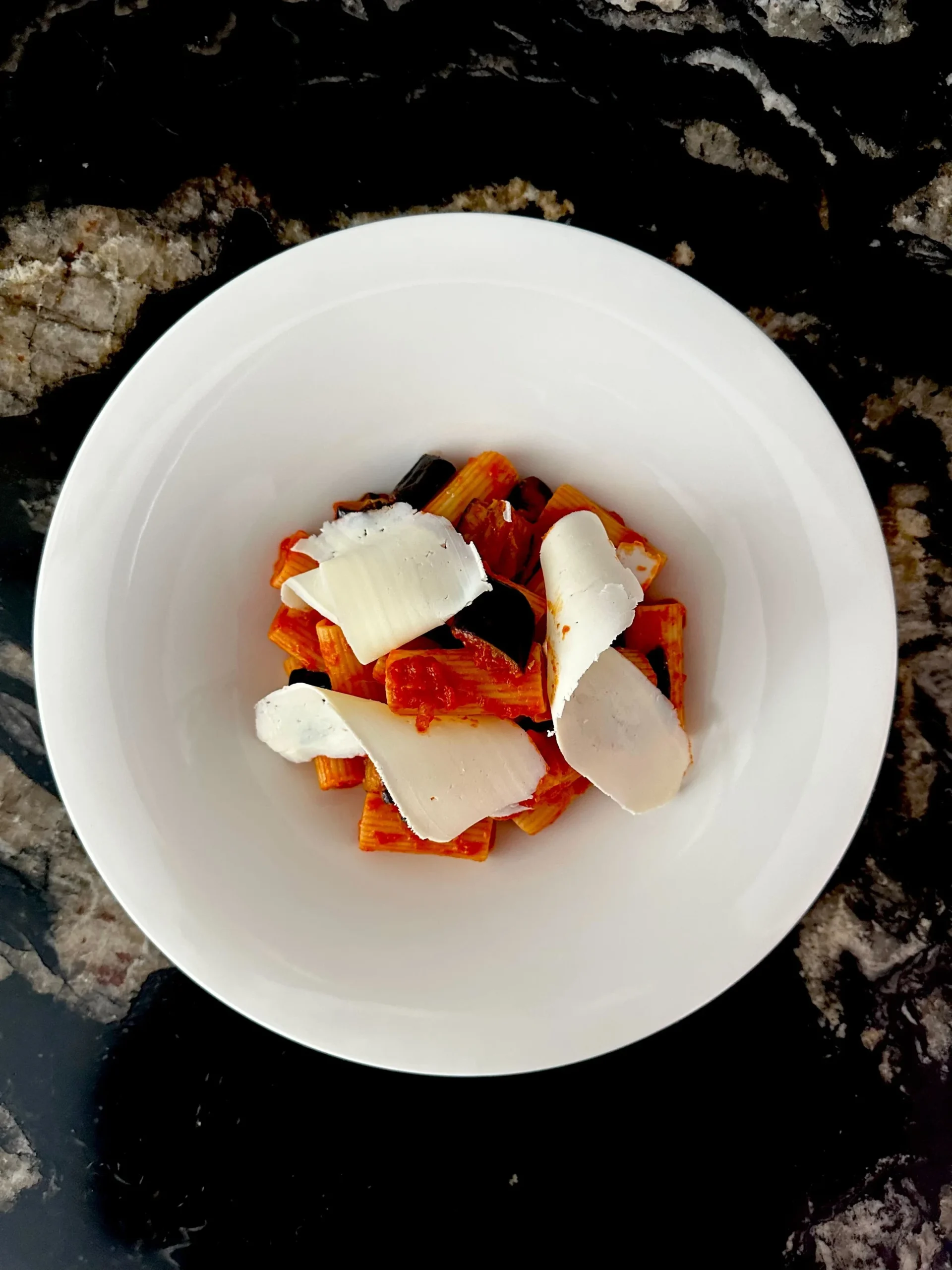 Pasta al pomodoro with shaved cheese