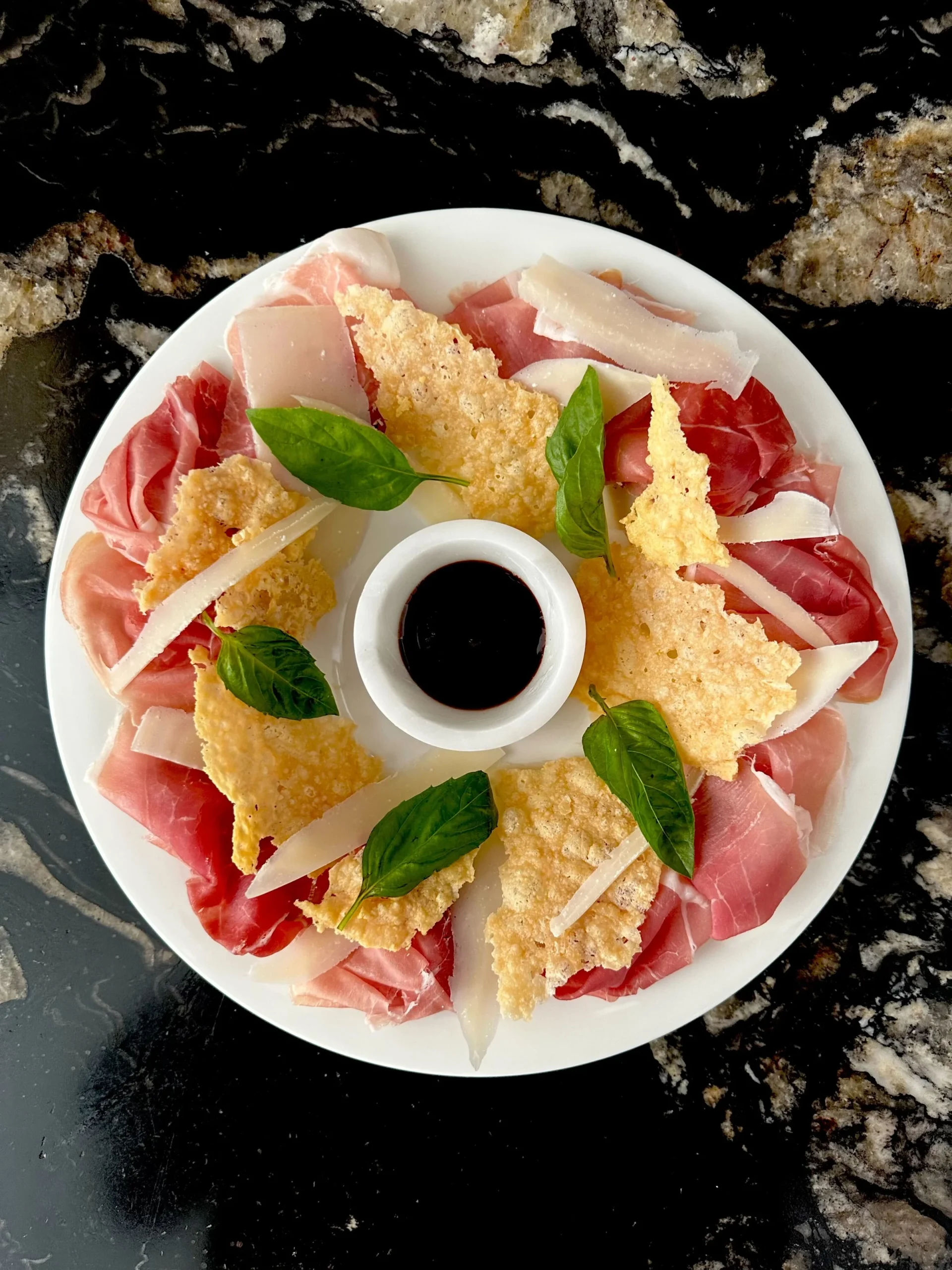 Italian antipasti plate with prosciutto and parmesan