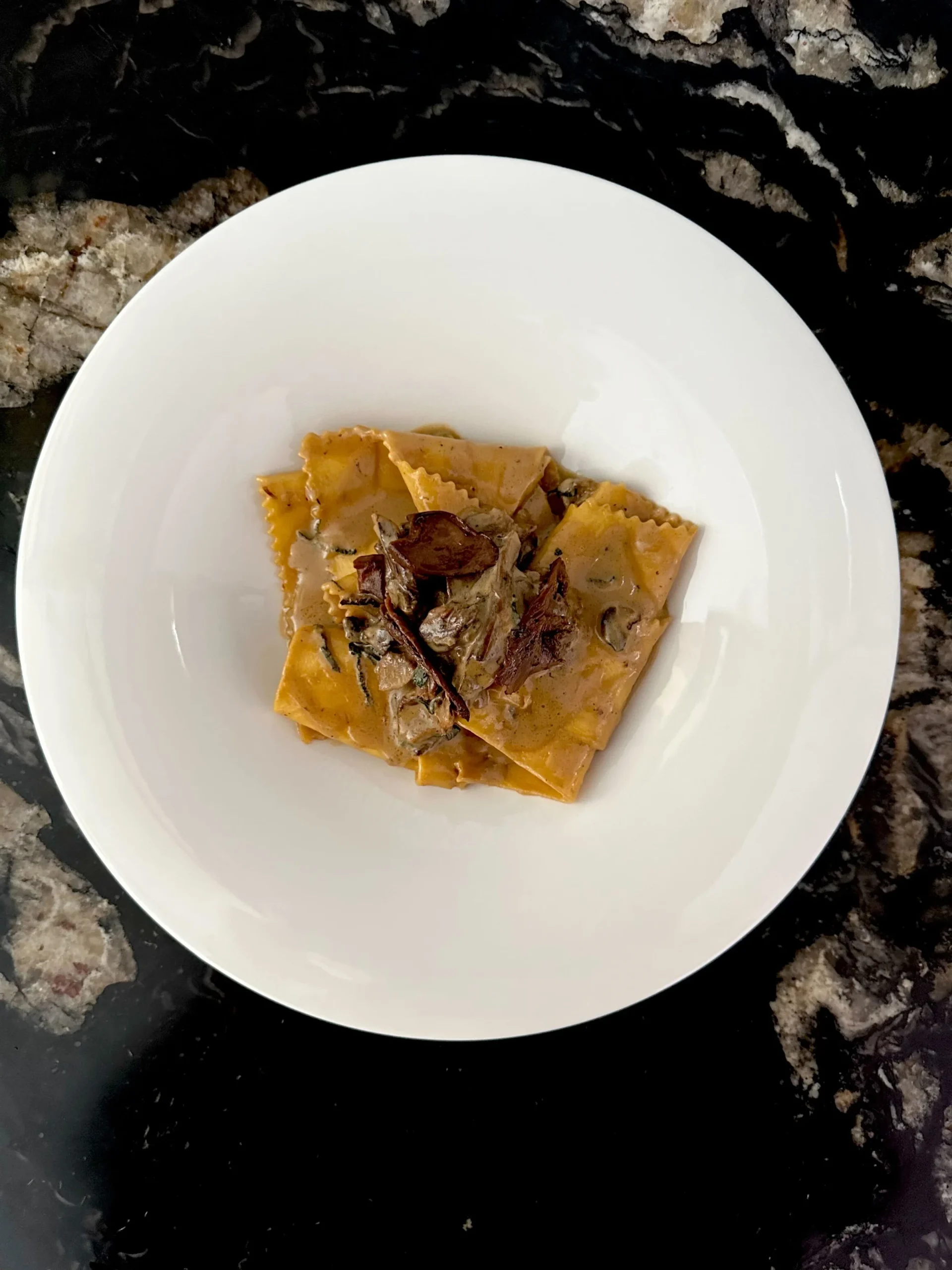 Wild mushroom pasta in a white bowl