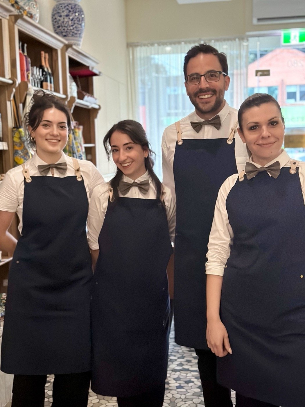 Tesoro Gastronomia team smiling inside the restaurant
